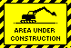 A small yellow rectangle with a black striped boarder reads 'AREA UNDER CONTSTRUCTION.' The silhouette of construction machinery digs a small hole in a loop.