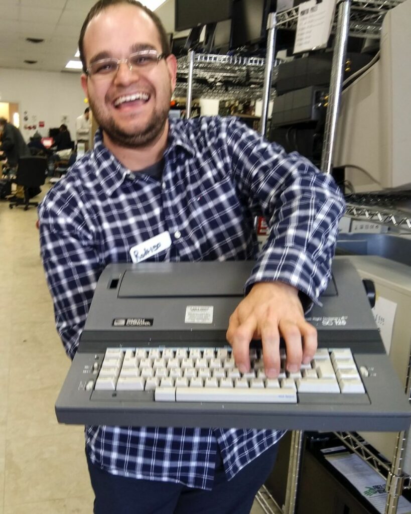volunteer with a typewriter
