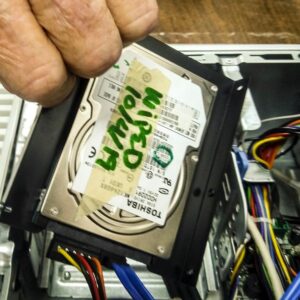 a hard drive in front of an open desktop